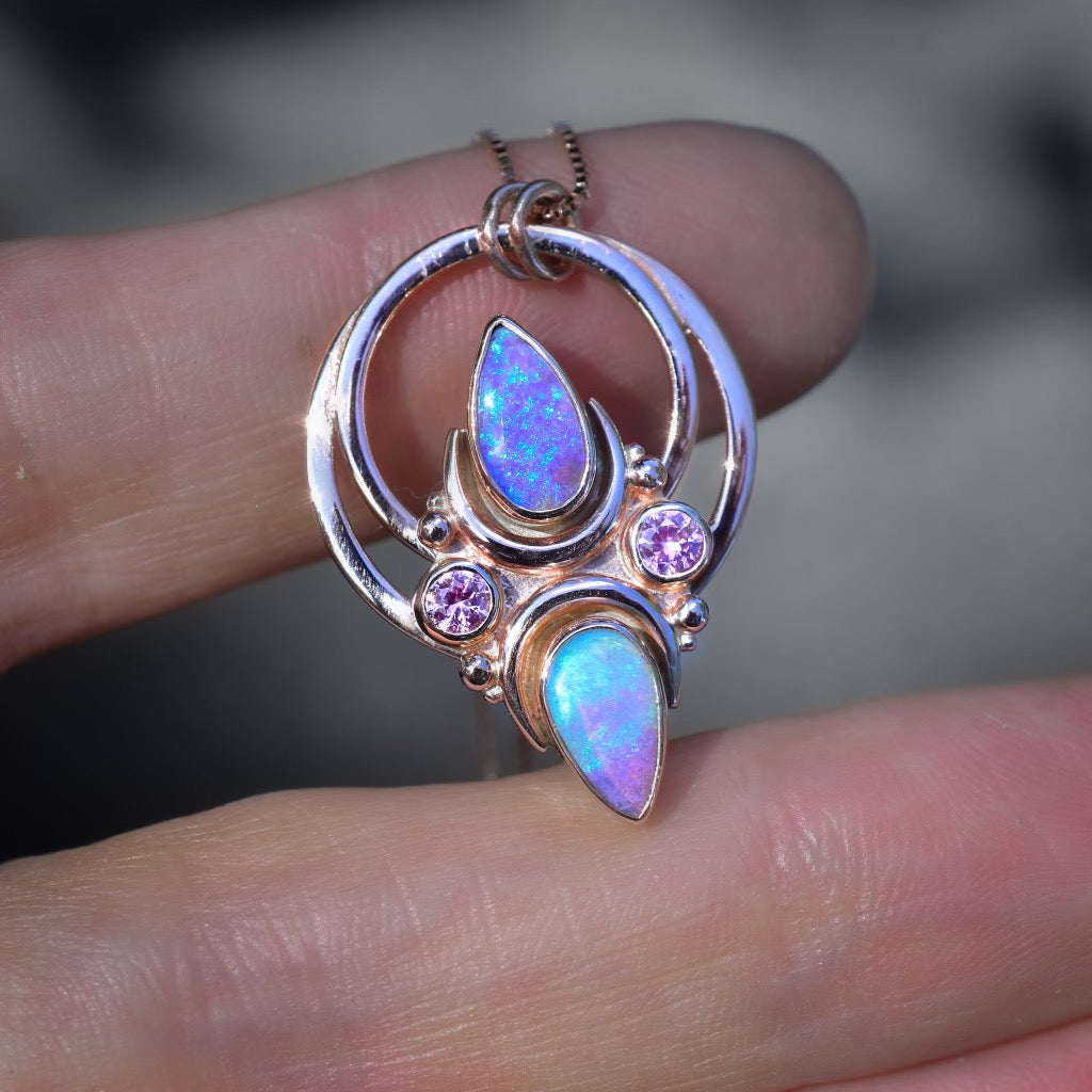 A Mini La Luna pendant (chain sold separately ) with Halo that has two beautiful  purple-aqua Australian opals and Lilac sapphires accents in solid 14k rose gold. - Angel Alchemy Jewelry