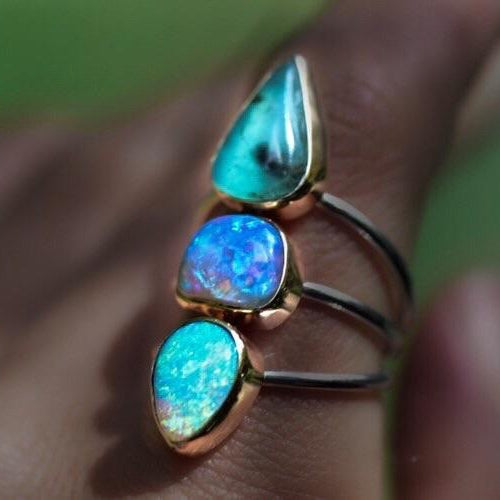 Australian and Peruvian Opal Talisman Ring with Gold Bezels
